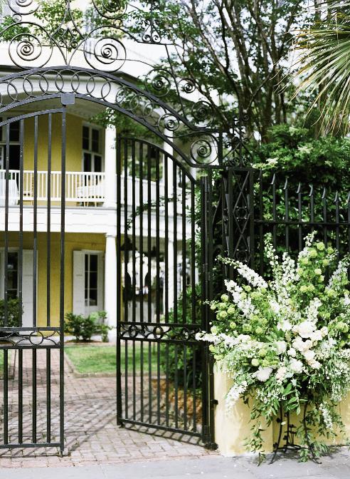 GREEN GREETINGS: In an unusual twist for the stalwart Charleston wedding location, Gathering Events placed enormous, springy arrangements outside the William Aiken gates, a treat for all Sunday passersby.