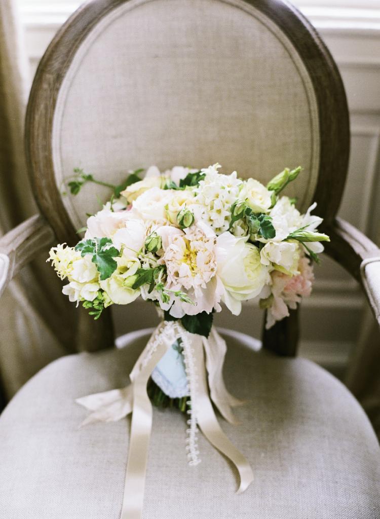 HANDLE WITH CARE: The bride carried an English-inspired bouquet of white,  pale yellow, and candy-floss  pink freesia, with garden  roses, hyacinth, lisianthus,  peonies, ranunculus, scabiosa, and scented geranium.