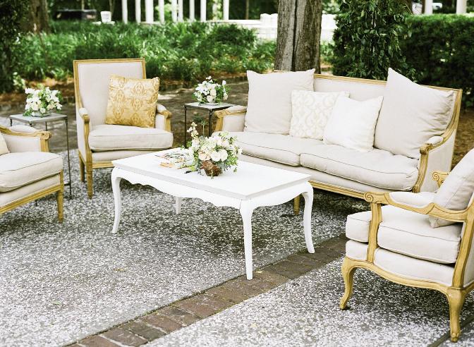 REST EASY: Plush upholstered chairs and settees created conversation nooks throughout the grounds.
