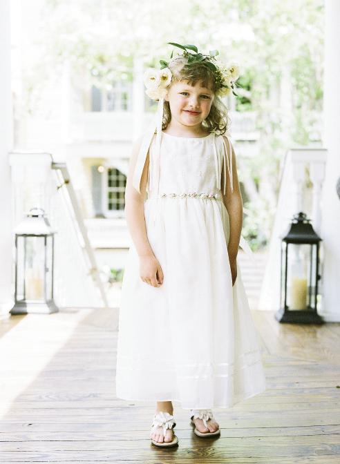 HATS OFF: Liz’s niece, Cate, happily donned a crown for her duties as flower girl.
