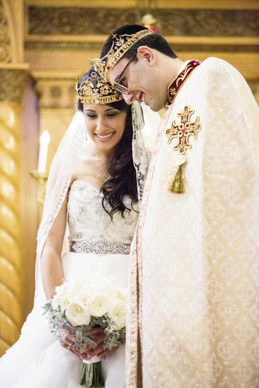 PRECIOUS METALS: Christine’s Lazaro gown featured silver detailing, while Boris’ ceremonial robe boasted a gilded cross.