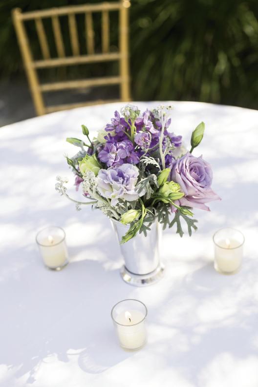 Jonie of A Charleston Bride potted lisianthus and ranunculus in varying shades, from eggplant to pale lilac.