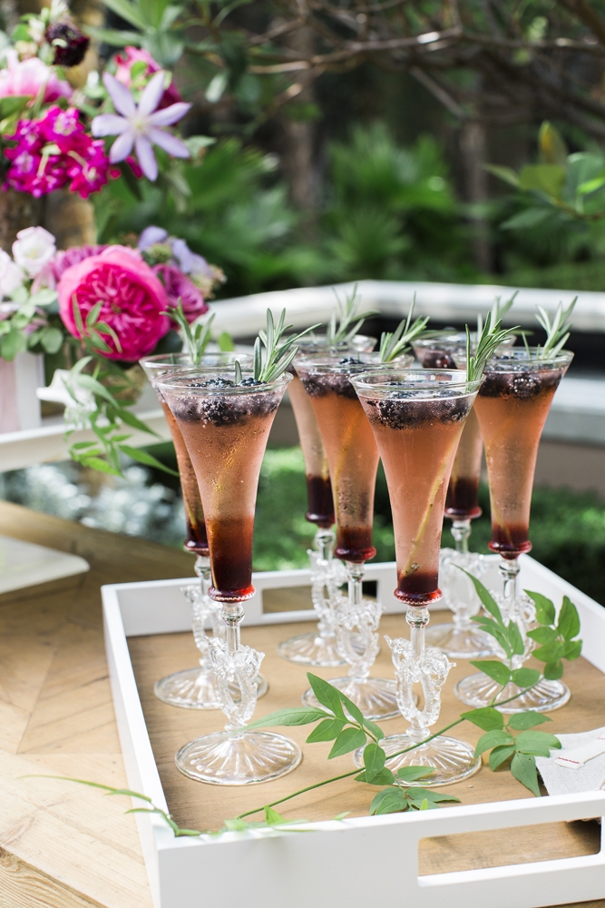 Greet guests with colorful, seasonal cocktails, like this berry and herb spritzer. “There’s nothing more festive or special than a ladylike cocktail crafted just for the occasion,” says Calder. “It says ‘I spent time on you’ and ‘J’adore.’”  &lt;i&gt;Photograph by Gayle Brooker&lt;/i&gt;
