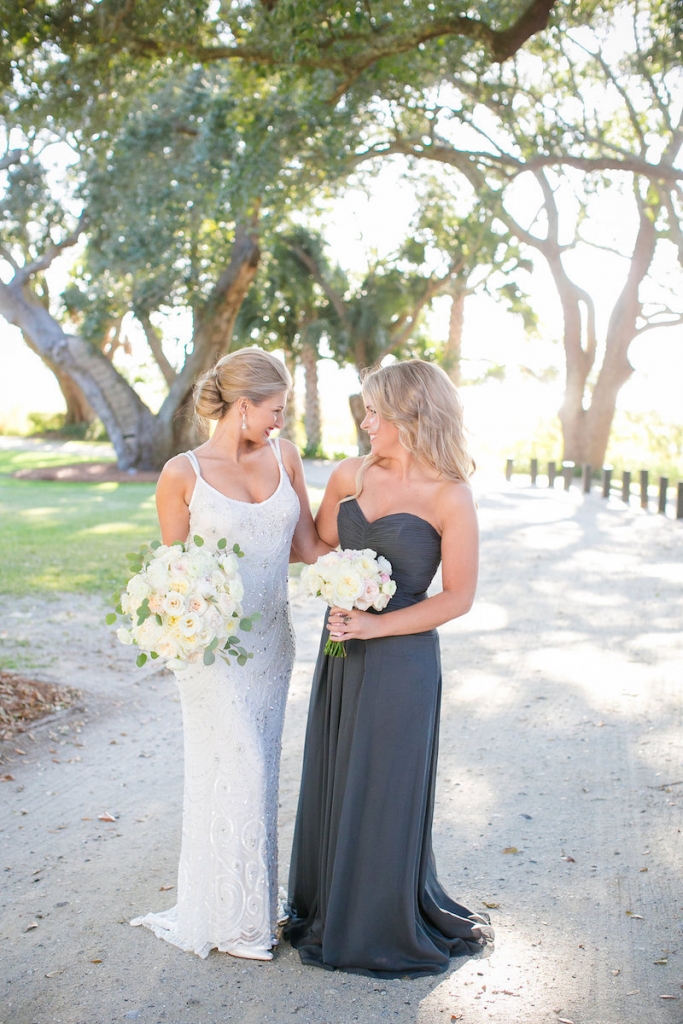Bride&#039;s gown from Gown Boutique of Charleston. Photograph by Dana Cubbage Weddings at Lowndes Grove Plantation.