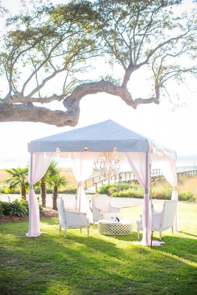 Wedding design by Pure Luxe Bride. Tent by Snyder Events. Lounge furniture by Nuage Designs. Photograph by Dana Cubbage Weddings at Lowndes Grove Plantation.