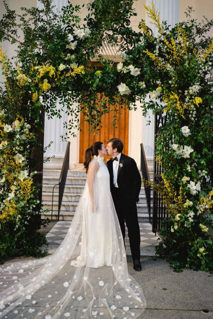 At this couple’s February nuptials, an abundance of eye-catching floral displays transformed the Greek Revival Hibernian Hall into a dreamscape of modern romance. (Opposite) Libby carried a charming bouquet of ranunculus, garden roses, daffodils, and sweet peas.