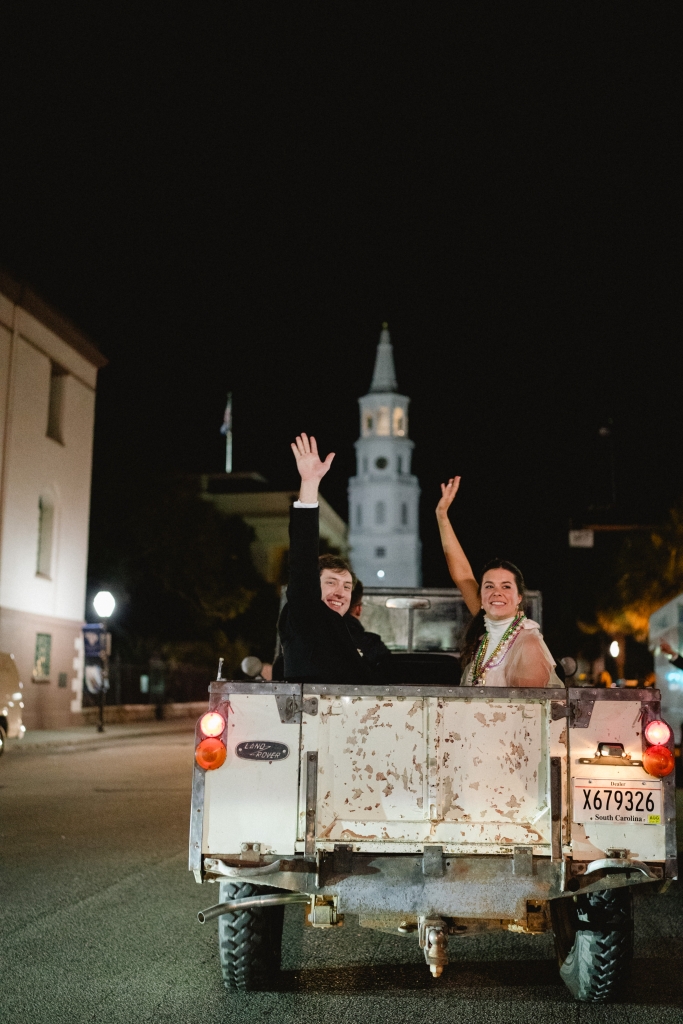 The couple departed in a vintage Land Rover.