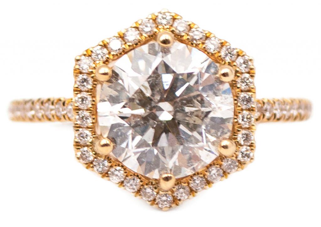 2.51 ct. round brilliantcut diamond set in 14K gold with diamondstudded (.30 total cts.) hexagonal halo and band from Sandler’s Diamonds &amp; Time ($24,898)