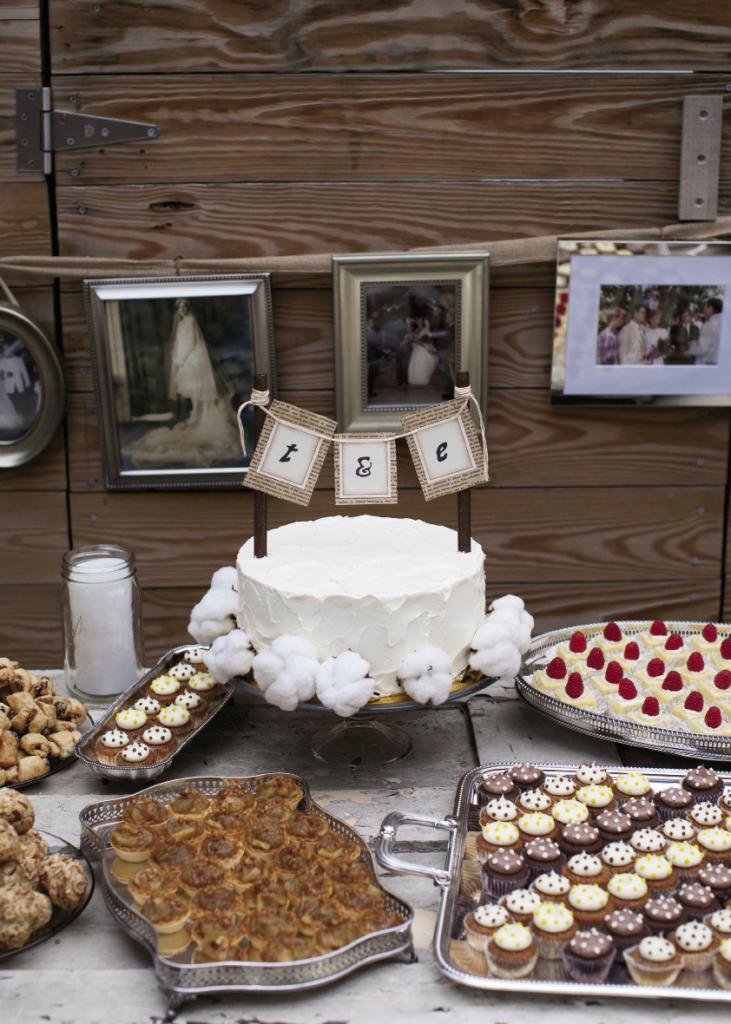 BANNER DAY: Surrounded by Twenty Six Divine treats served on silver pooled from both families, the cake wore a banner made from pages of Pride and Prejudice.
