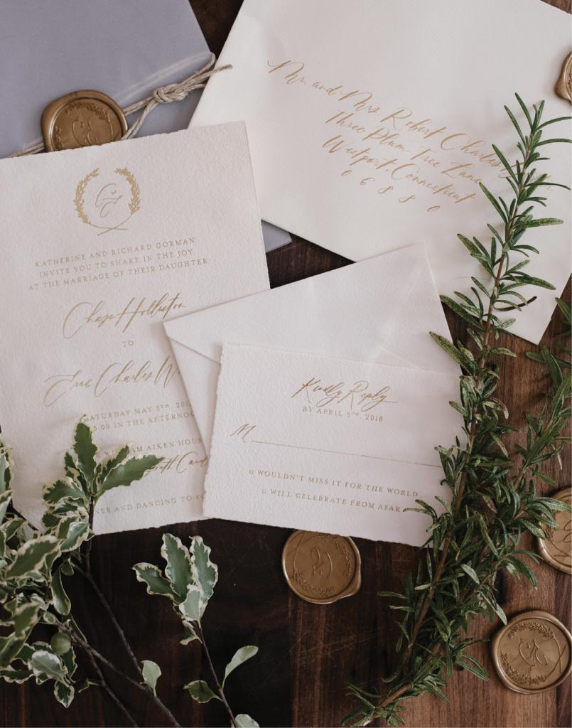 A monogram ringed in greens appeared on the invitation suite and its wax seals. “I fell in love with the way Carol Hannah uses fabric to create her aesthetic,” says Chase of her custom attire.