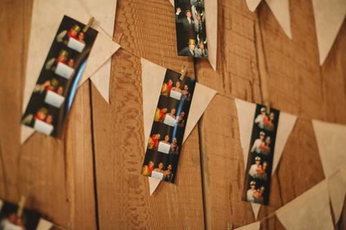 MEMORY LANE: To make guests truly feel a part of the day, incorporate photo strips from one of the parties leading up the wedding—or from the wedding itself if you hire a photo booth.