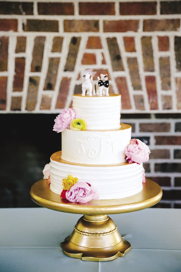 PUPPY LOVE: The Cake Stand painted cake tier tops in gold, then capped everything off with bull-terrier salt and pepper shakers Jennifer had dressed up as an ode to the couple’s dog.