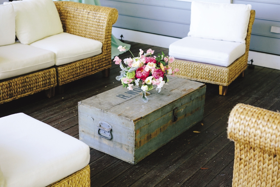 DOUBLE DUTY: A lovingly worn turquoise antique trunk from 428 Main Vintage Rentals served as a coffee table.