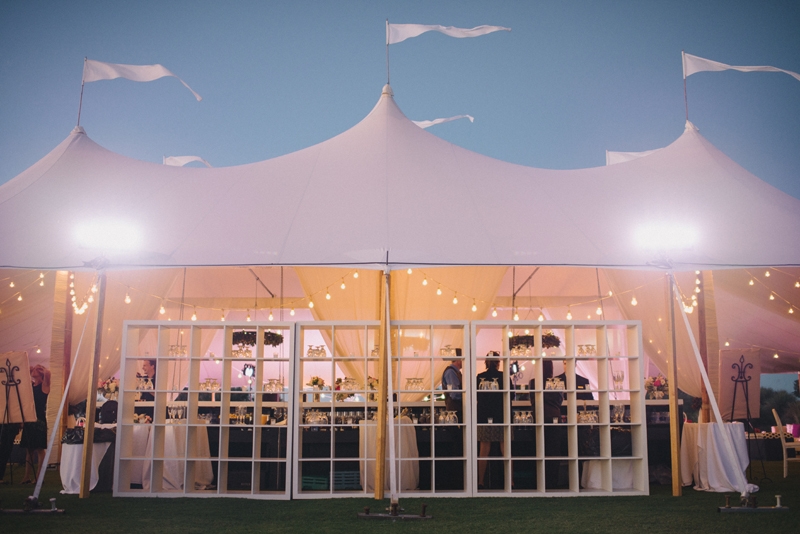 Wedding design by A Charleston Bride. Tent by Sperry Tents Southeast. Lighting and tent structure by Technical Event Company. Photograph by Sean Money &amp; Elizabeth Fay at the Ocean Course at Kiawah Island.
