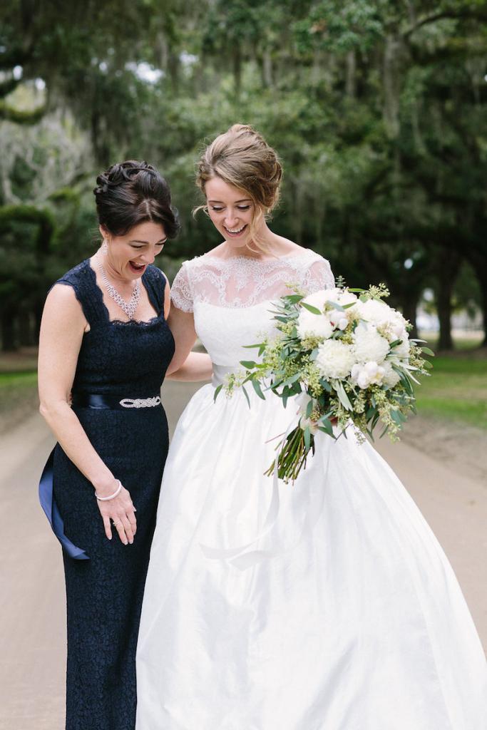 Bride&#039;s gown by Tara Keely. Bridesmaids&#039; dresses by Adrianna Papell (available locally at Bella Bridesmaids). Florals by Lauren Luecke. Hair by Krystal Yangco. Image by Julia Wade Photography at Boone Hall Plantation.