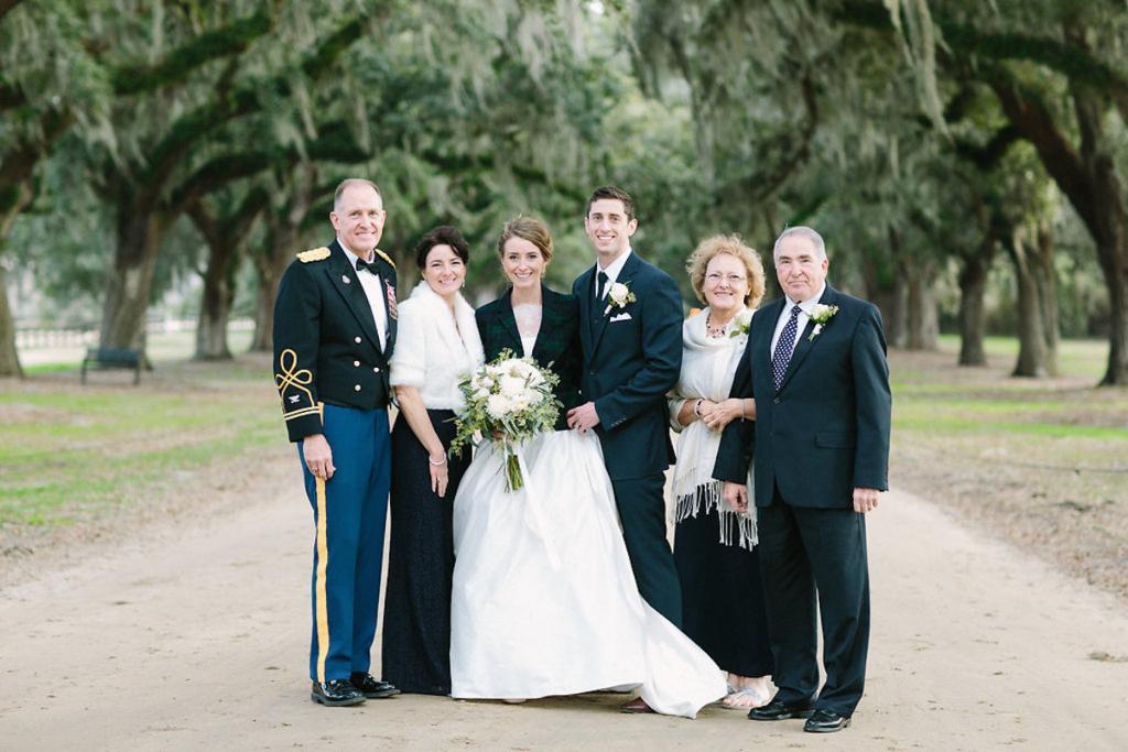 Bride&#039;s gown by Tara Keely. Florals by Lauren Luecke. Image by Julia Wade Photography at Boone Hall Plantation.