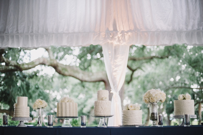 Wedding cakes by Fish Restaurant. Florals by Tiger Lily Weddings. Wedding design and coordination by Lindsey Shanks of A Charleston Bride. Photograph by Sean Money + Elizabeth Fay at Lowndes Grove Plantation.