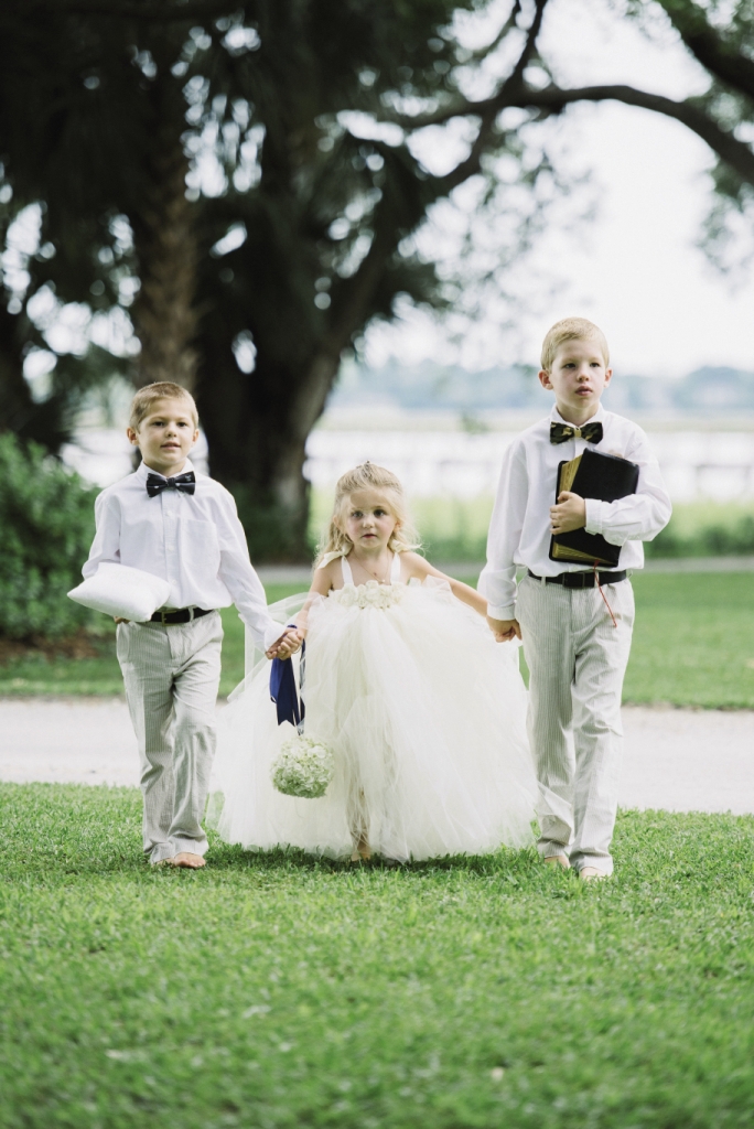 WEET TRIO: Flower girl Ann Hobson, Julie’s  goddaughter, wore a dress by Tutully Cute Designs from Etsy. Julie’s nephew Landon Daubenspeck served as ring bearer, while his older brother Noah carried Julie’s late grandmother’s Bible.