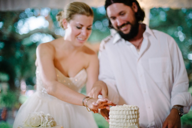 Wedding cakes by Fish Restaurant. Bride’s dress by Reem Acra. Wedding design and coordination by Lindsey Shanks of A Charleston Bride. Photograph by Sean Money + Elizabeth Fay at Lowndes Grove Plantation.