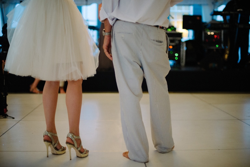 : Bride’s dress by Reem Acra. Bride’s shoes by Jimmy Choo. Groom’s suit by Hardwicks. Photograph by Sean Money + Elizabeth Fay.