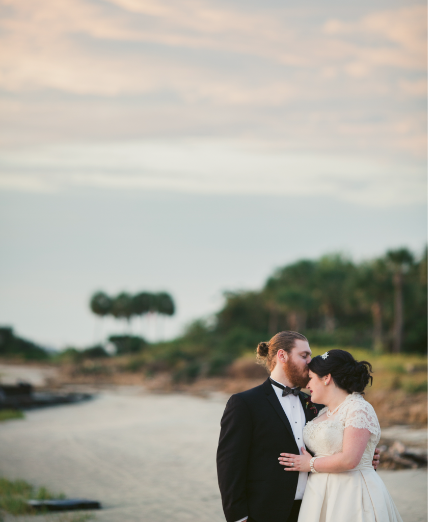 Victoria chose their Halloween wedding date not for the holiday, but for its proximity to the month’s full moon. “The tide pulls back enough to give you a tiny private beach [at my parents&#039; house], which makes for great photos,” she says.  (Image by Juliet Elizabeth Photography)