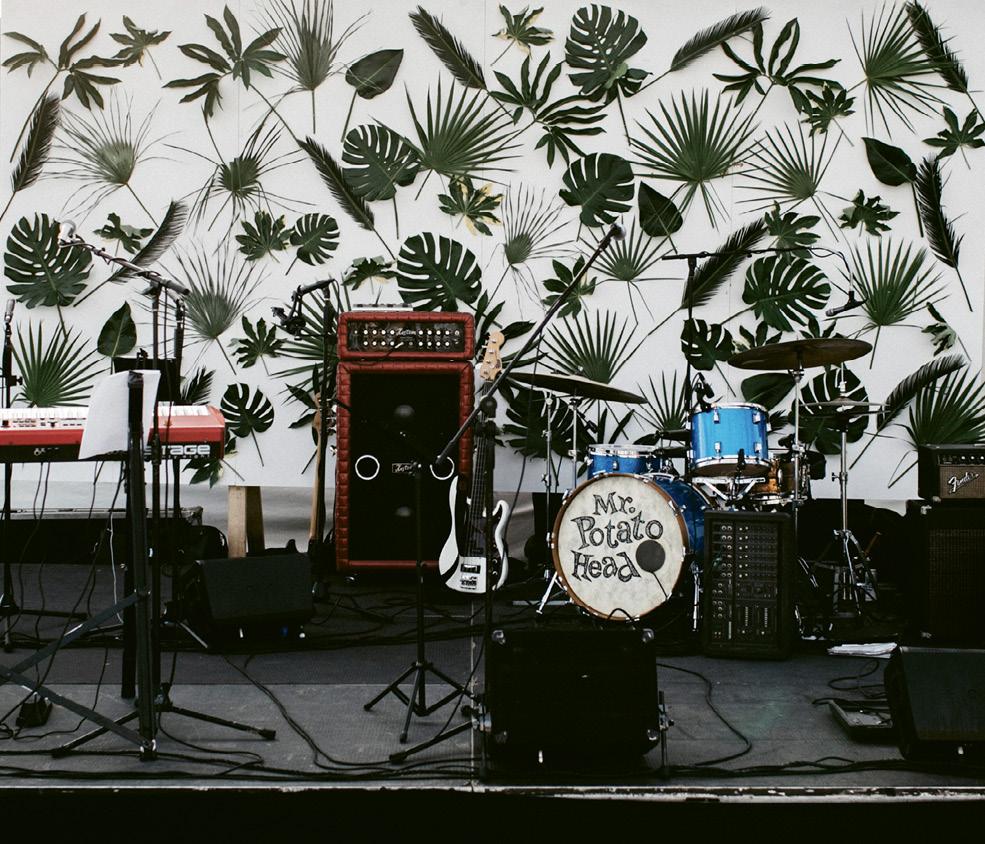 A wall punctuated with tropical leaves made up the bandstand backdrop. The last song of the night was “Don’t Stop Believin’” by Journey, which had everyone on their feet.