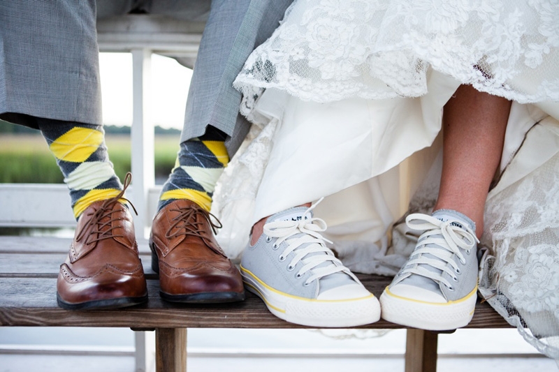 Groom’s attire from JoS. A. Bank. Bride’s shoes by Converse. Image by Hunter McRae Photography at the Creek Club at I’On.