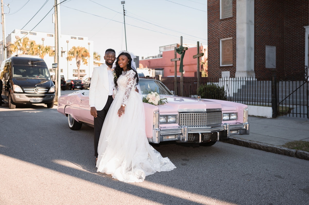 The couple traveled from the church to their reception at in a showstopping pink Cadillac loaned from a family friend.