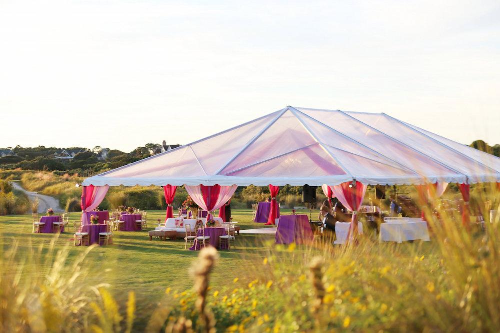 Wedding design by A Charleston Bride. Tent by Snyder Events. Image by Lindsay Collette Photography at The Ocean Course at Kiawah Island.