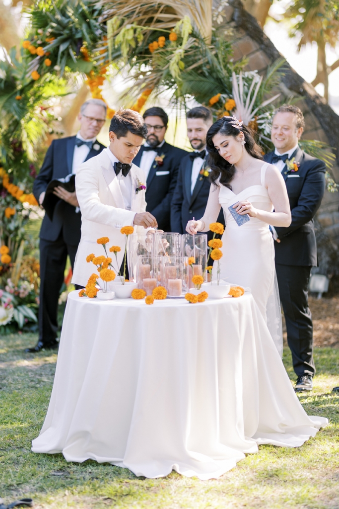 The ceremony was rich in elements representing the couple’s family roots, including a Hindu wedding ritual that involves taking seven steps around a fire—here, represented by a table topped with candles.