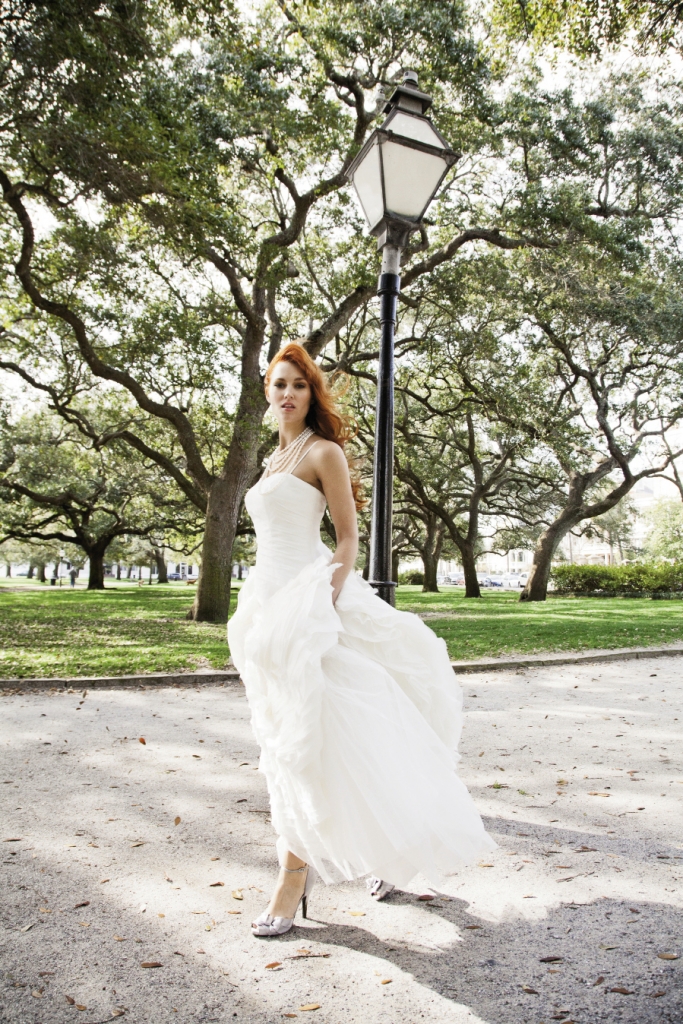 A WALK IN THE PARK: Martina Liana tiered silk organza gown from Gown Boutique of Charleston. Five-strand pearl necklace from Croghan’s Jewel Box. Nina’s d’Orsay heels from LulaKate.
