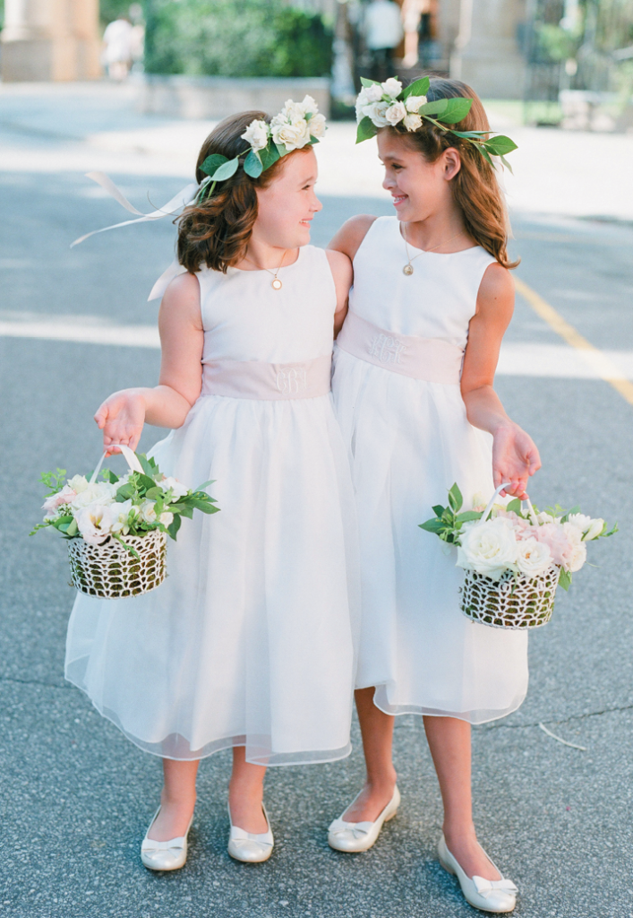 Bosom Buddies - Flower girls Caroline and Kennedy are first cousins of bride Libby. The junior attendants’ monogrammed sashes were made from extra fabric Libby ordered with the bridesmaids’ gowns. “The girls felt extra-special when they got soft curls and a touch of makeup,” says Libby.