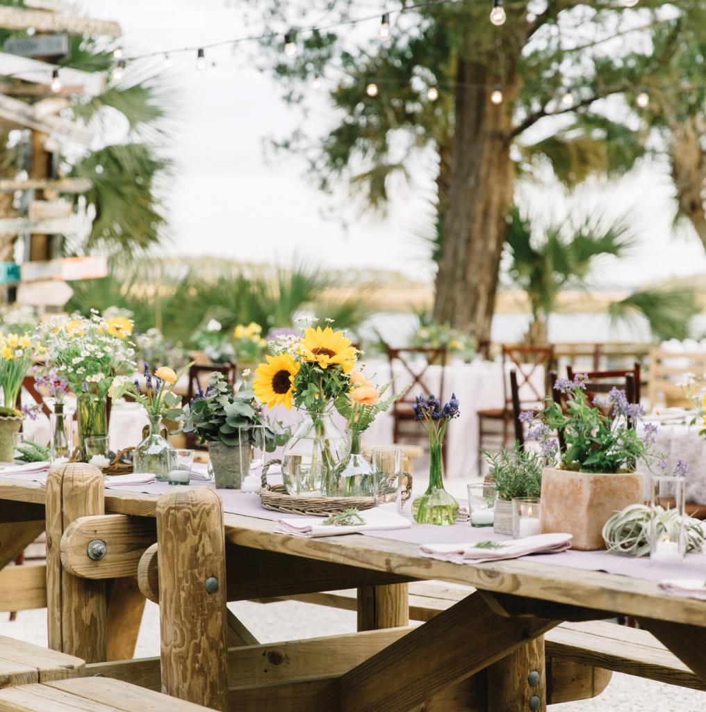 At Courtney Shea and Braden Smith’s rehearsal dinner at Montage Palmetto Bluff, Jackson Durham Events crafted florals around the Kansas-born groom’s home-state bloom, the sunflower. Why? The NFL offensive tackle just so happens to be an avid gardener.