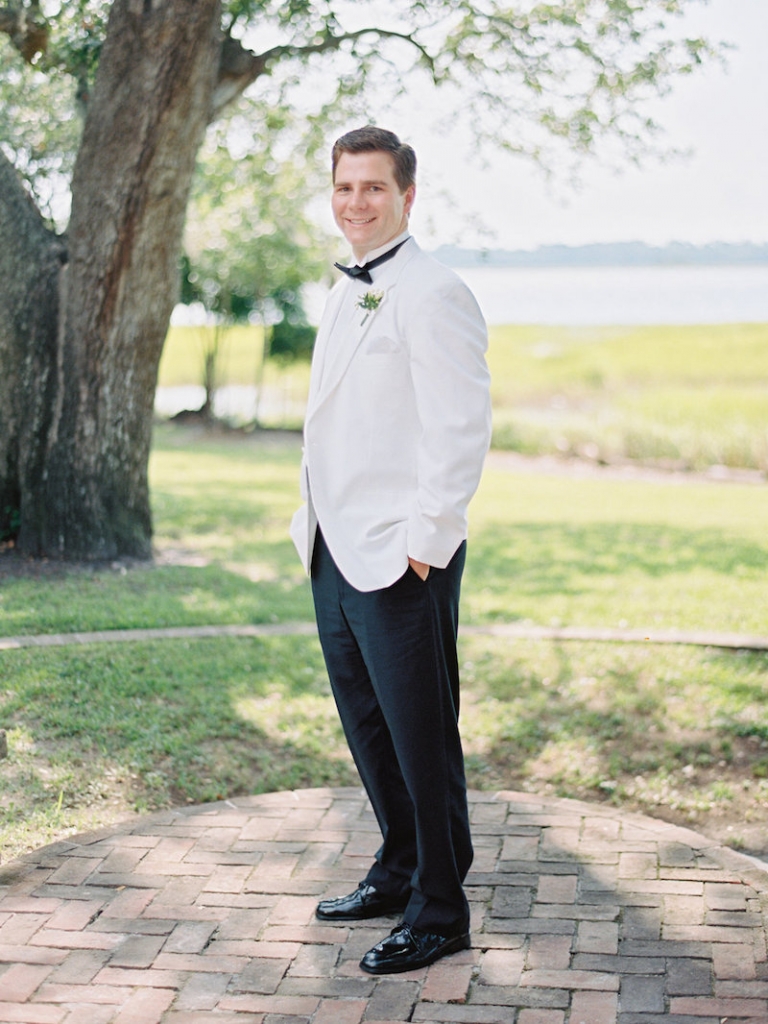 Groom&#039;s attire from Mens Wearhouse. Image by Ryan Ray Photography.