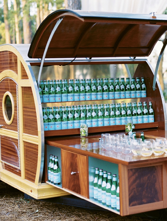 A chic bar cart was filled with sparkling water on the way in.