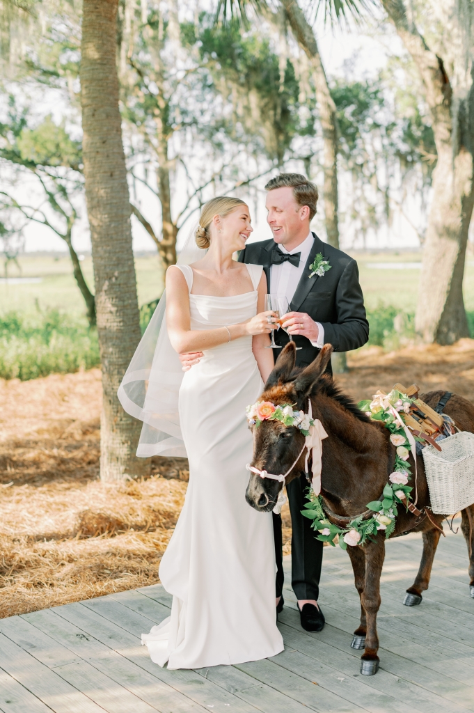 Guests were delighted by the Champagne-toting Kate the black burro—a playful nod to Ruthie’s family roots in Louisville, Kentucky, (it was Derby Saturday, after all) and her own equestrian background; coastal charm permeated the wedding aesthetic.