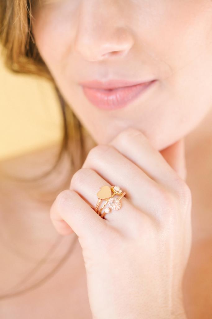 Rose gold heart ring and morganite and diamond open ring, both from Gold Creations. Chan Luu’s cameo ring from Out of Hand. Matthew Christopher’s “Felicity” gown from Southern Protocol Bridal.
