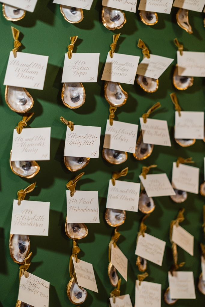 An ode to the couple’s love of oysters, the escort wall featured shells fashioned into keepsake ornaments.