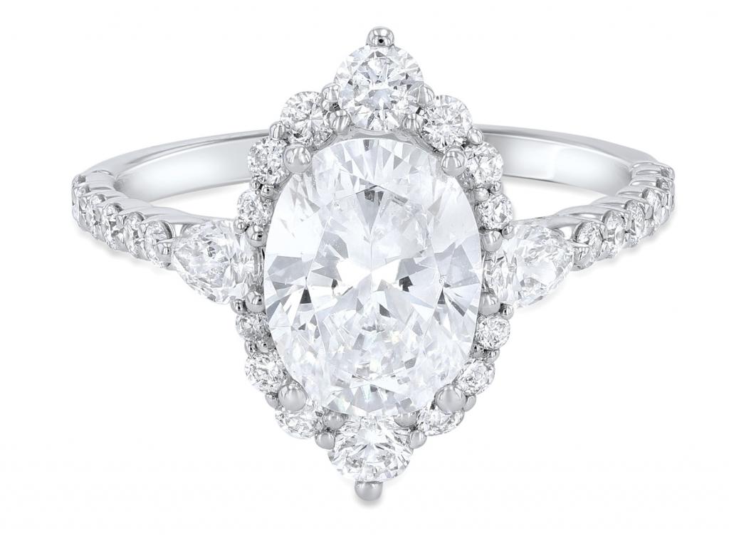 Vintage oval diamond accented by round- and pear-cut diamonds (.72 total cts.) in 14K white gold from Diamonds Direct ($2,450)