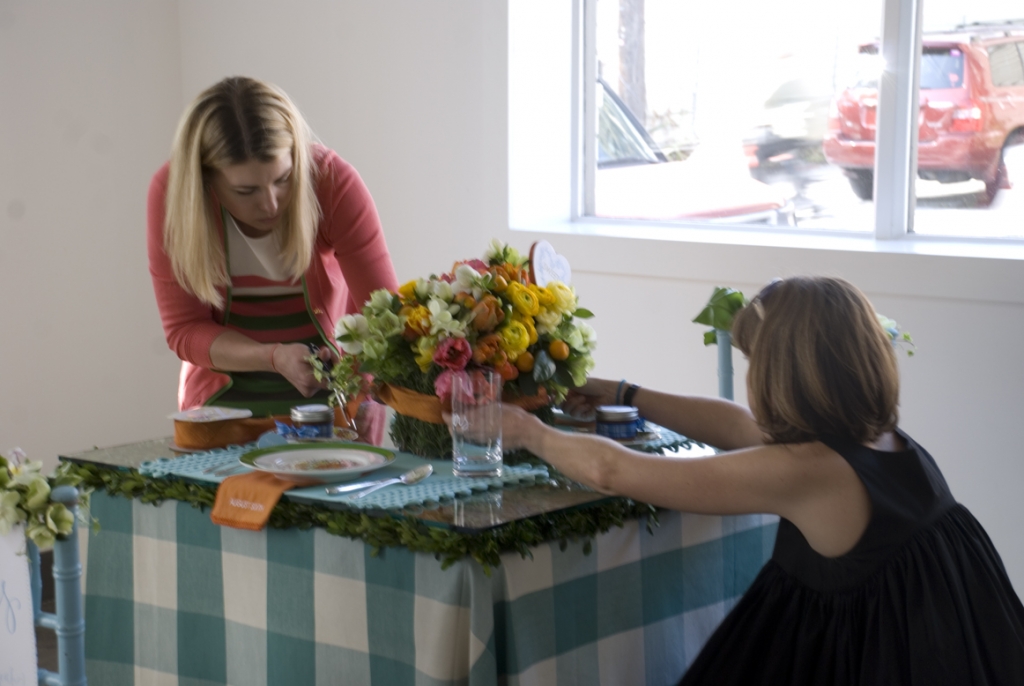 I felt like the tabletop arrangement needed a little break in the color, so Anne and I tied a band of Midori silk around it. I loved how it pulled the orange from the napkins onto the table.
