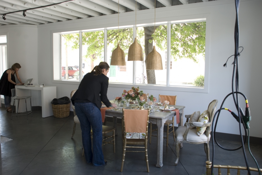Melissa Barton (right) puts some finishing touches on the A Charleston Bride table.