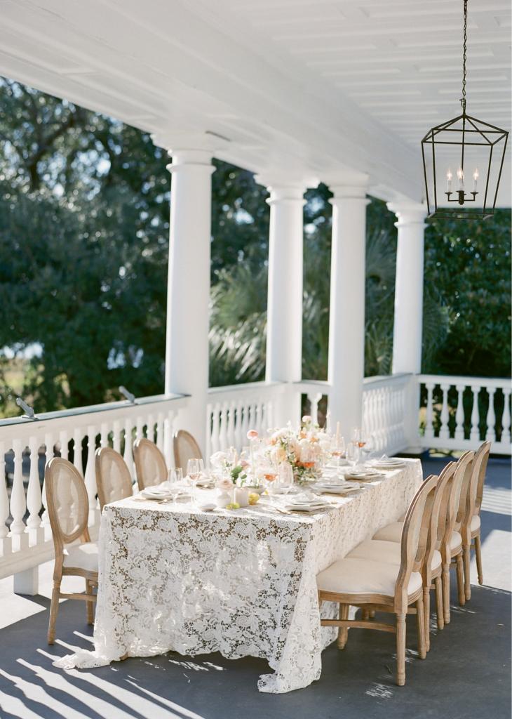 The piazza at Lowndes Grove Plantation is most often used for portraits and cocktail hours; in this imagined wedding, it’s ideal for al fresco dining. If you choose a lace with appliqués, consider using place mats and other toppers to create level surfaces.