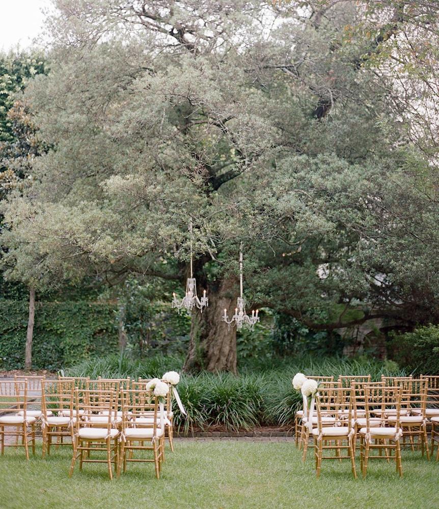 Event design, floral design, and lighting by Gathering Floral + Event Design. Chairs from Snyder Events. Photograph by Marni Rothschild Pictures at the William Aiken House.