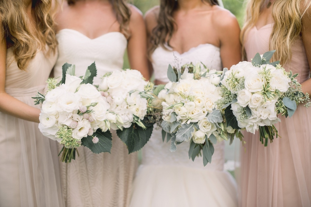 Florals by Out of the Garden. Bride&#039;s gown by Legends by Romona Keveza (available locally through Maddison Row). Bridesmaid dresses from Bella Bridesmaids. Image by Timwill Photography.