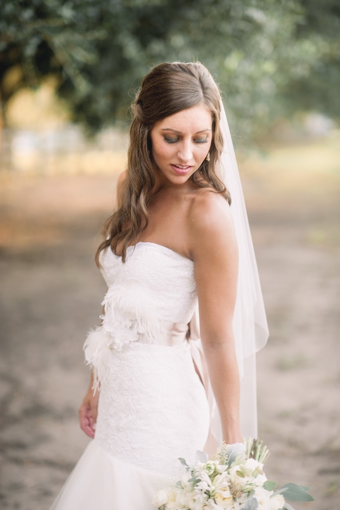 Bride&#039;s gown by Legends by Romona Keveza (available locally through Maddison Row). Hair by Wedding Hair by Charlotte. Makeup by Pamela Lesch Makeup. Image by Timwill Photography.