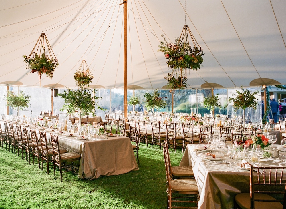 Wedding design by Easton Events. Florals by Charleston Stems. Tent by Sperry Tents Southeast. Chiavari chairs and tables from Festive Fare. Linens from La Tavola. Image by Corbin Gurkin Photography at Yeamans Hall Club.