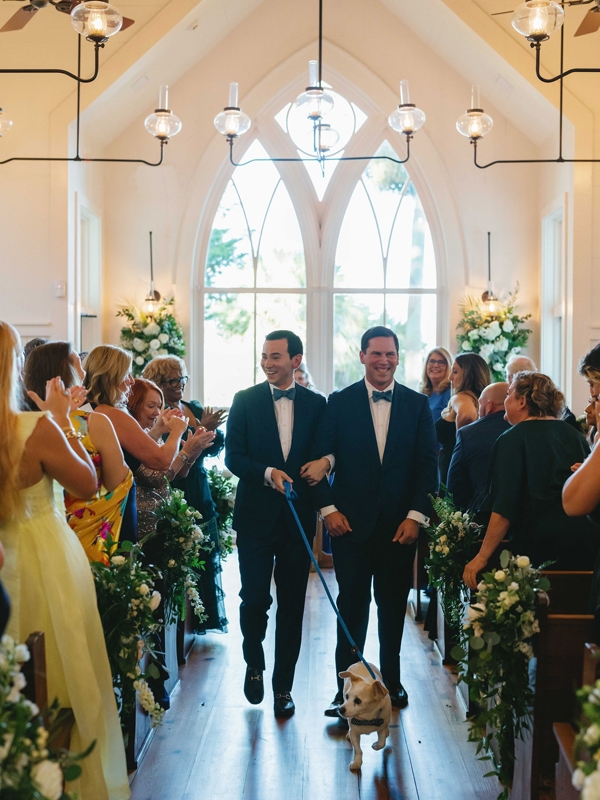 (Clockwise from top left) Rusty led the newlyweds back down the aisle after the ceremony. The May River Chapel’s arched windows afforded guests stunning views of the salt marsh.