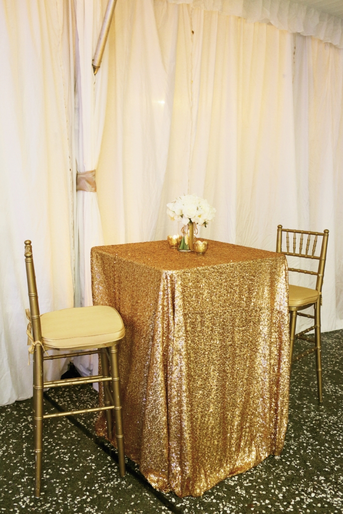 Cover small cocktail tables—rather than large dining tables—in your priciest and showiest fabric to save money and pace your style statements. Linens by La Tavola. Rentals by EventWorks. Image by The Connellys.