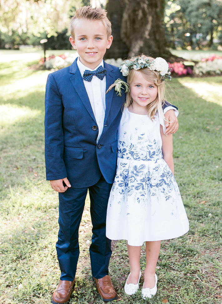 First cousins to the bride (and offspring of one of her bridesmaids), Blake and Taelen served as junior usher and flower girl in the Souders-Colao wedding. “Taelen,” says Brittney, “set the stage for me to walk down the aisle by passing out petals individually to guests.&quot; Image by Jenna Marie Weddings