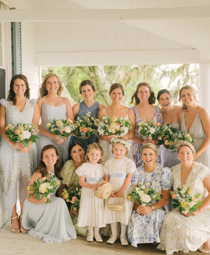 Bridesmaids selected their own dresses within a palette, while the flower girl’s dress was handmade by the bride’s relatives and has been worn in four family weddings over the years.